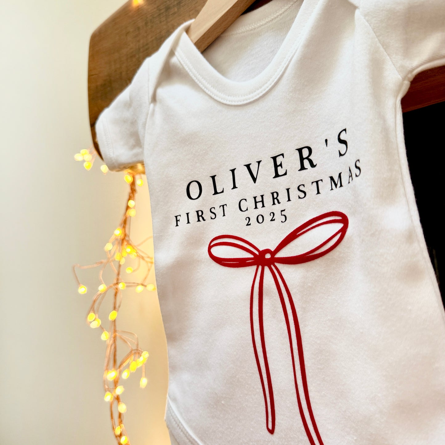 Personalised Baby's First Christmas Bow Baby Grow
